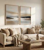 cozy neutral living room with two vertical abstract landscape prints above beige sofa